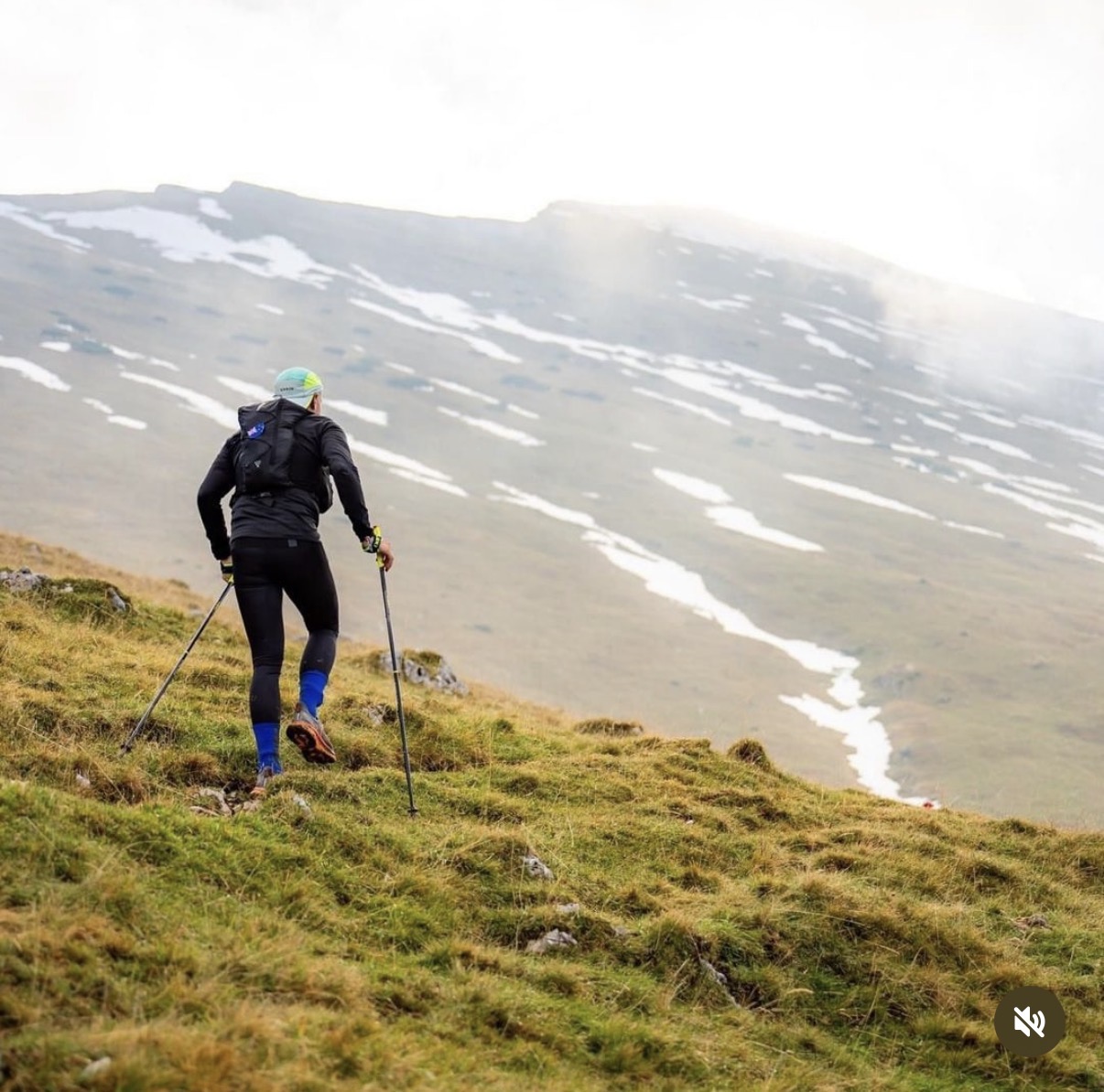 Ultra runner ascending an alpine ridge